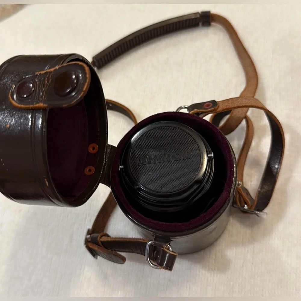Classic Nikon 85mm F1.8 Non AI Nikkor aka “The portrait lens” w/leather case